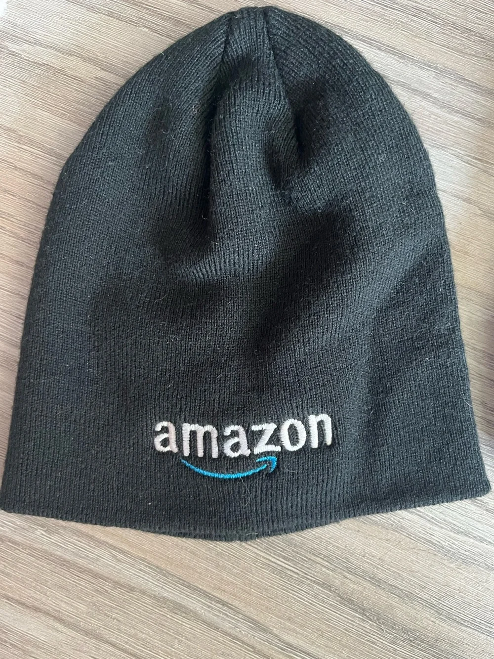 Amazon Black Knit Beanie with White Logo and Blue Arrow.  0004
